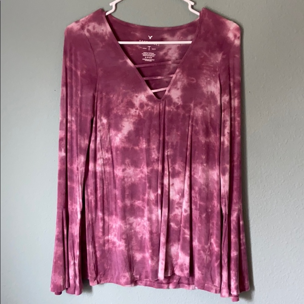 Blush/distressed long sleeve flared top